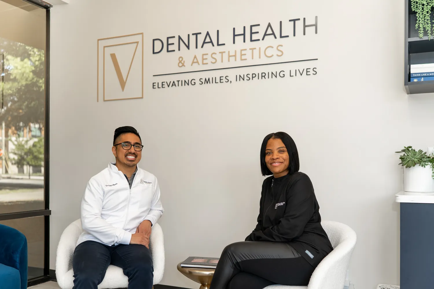 Dentist and patient seated together in the dental office