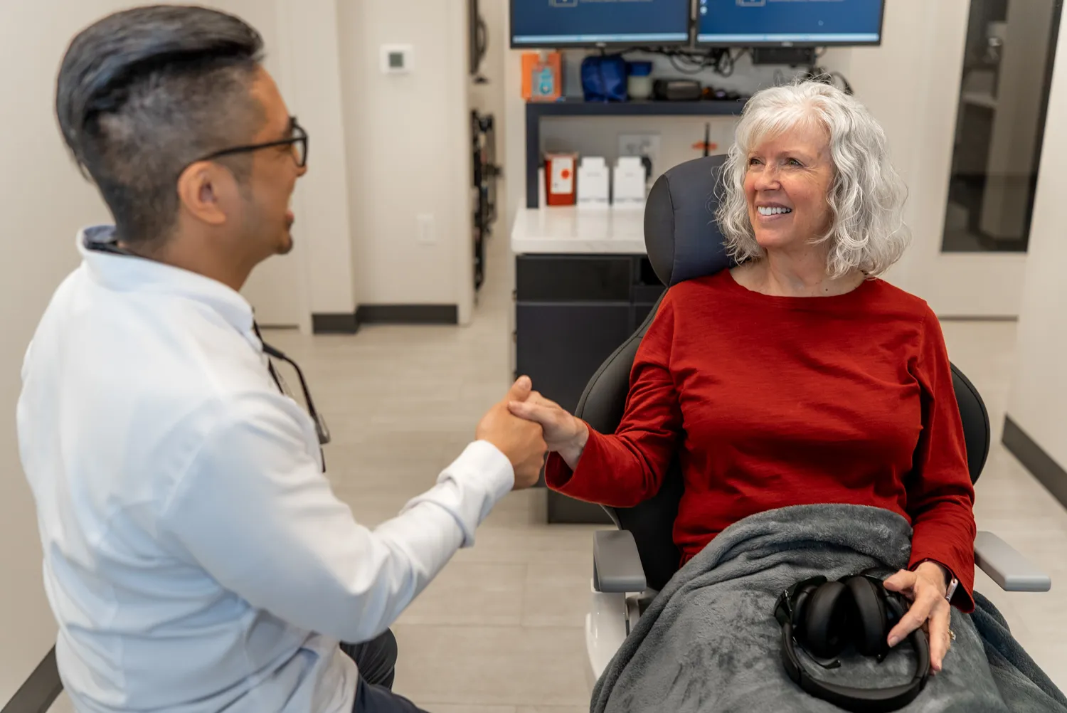Dentist greeting a patient in the office